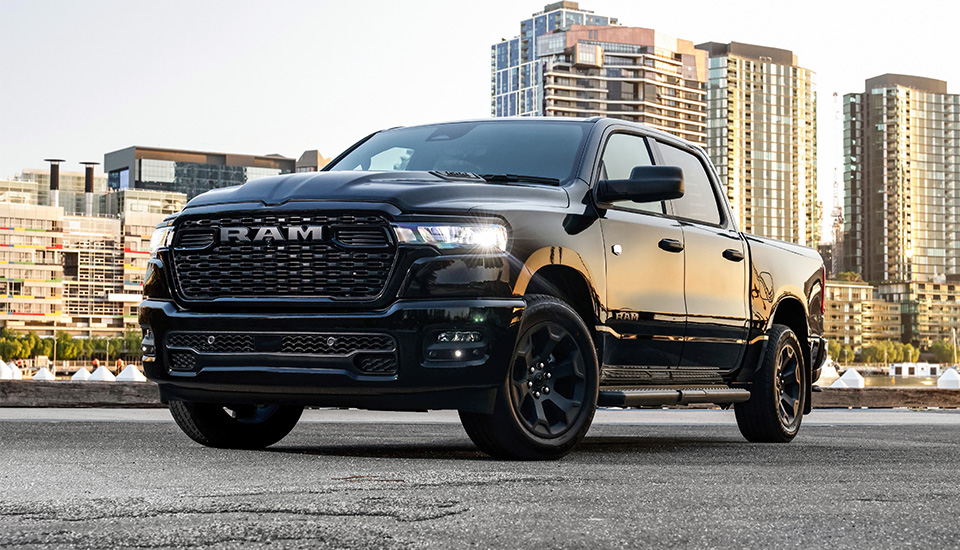 Exterior of a black RAM 1500 Express parked in a city